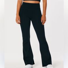 Comfortable, Wear Everywhere Flare Leggings In Soft Jersey Fabric Featuring A Flattering Ultra High Rise Waist & Front Seam Detail Brand : Hollister - Gilly Hicks Size : Xsmall Short. Short Inseam - 28.5” Color : Black Material & Measurements : Body - 90% Cotton, 10% Elastane Condition : New With Tags. No Damages/Flaws. Smoke Free Home Black High Rise Loungewear Bottoms, Fitted High-waisted Workout Bottoms, Black High Waist Relaxed Fit Yoga Pants, Fitted Wide Leg Gym Bottoms, Fitted Wide Leg Loungewear Activewear, Fitted High-waisted Sports Pants, Fitted Wide Leg Activewear For Loungewear, Black Wide Leg Loungewear Leggings, Sporty Fitted High-waisted Pants