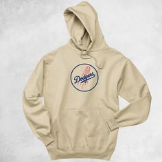 Dodgers heavy blend hoodie, Los Angeles Dodgers, Dodgers Clothing, This unisex heavy blend hooded sweatshirt is relaxation itself. Made with a thick blend of cotton and polyester, it feels plush, soft and warm, a perfect choice for any cold day. In the front, the spacious kangaroo pocket adds daily practicality while the hood's drawstring is the same color as the base sweater for extra style points.\n.: 50% cotton, 50% polyester\n.: Medium-heavy fabric (8.0 oz/yd² (271 g/mn.: Classic fit\n.: Tea Fan Merchandise Cotton Hoodie With Crew Neck, Cotton Hoodie Crew Neck For Fan Merchandise, Cotton Crew Neck Hoodie For Fan Merchandise, Throwback Crew Neck Hoodie For Fan Merchandise, Cotton Hoodie With Graphic Print For Fans, Cotton Sweatshirt With Drawstring Hood For Fans, Cotton Graphic Print Hoodie Fan Apparel, Fan Merchandise Cotton Hoodie Sweatshirt, Cotton Fan Merchandise Hoodie Sweatshirt