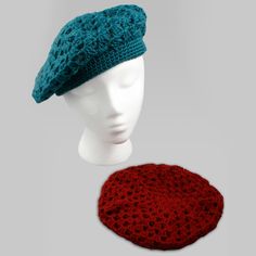 a crocheted hat is next to a mannequin's headpiece