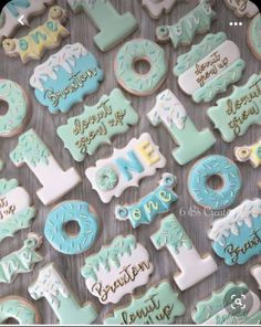 decorated cookies are arranged in the shape of letters, numbers and other things to eat