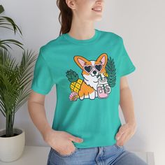 Introducing our Summer Corgi Unisex Graphic Tee – a must-have addition to your warm-weather wardrobe that combines adorable corgi charm with the laid-back vibes of summer! This tee isn't just clothing; it's a fun and stylish way to celebrate your love for these delightful pups and the sunny season. Crafted for both men and women who adore corgis, this tee is perfect for adding a touch of whimsy to your summer look, whether you're lounging at the beach or soaking up the sun by the pool. Featuring a playful corgi graphic and made from high-quality materials for comfort and durability, this tee is sure to become a favorite in your collection. Whether you're a proud corgi lover or searching for the perfect gift for a fellow dog enthusiast, our Summer Corgi Unisex Graphic Tee is guaranteed to b Dog Print Crew Neck Graphic Tee, Summer Dog Print Relaxed Fit T-shirt, Funny Dog Print Crew Neck T-shirt, Summer Relaxed Fit T-shirt With Dog Print, Trendy Crew Neck T-shirt With Dog Print, Relaxed Fit Short Sleeve Tops With Dog Print, Summer Dog Print Graphic Tee, Summer Dog Print Short Sleeve Top, Summer Short Sleeve T-shirt With Dog Print