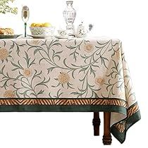 a table covered with a white and green cloth