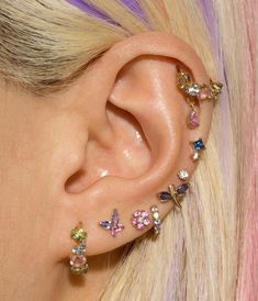 a close up of a person with ear piercings