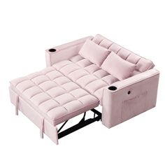 a pink couch with two pillows sitting on it's back and one arm facing the camera