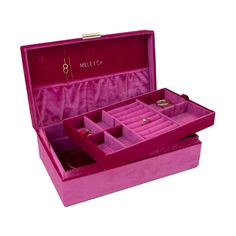 a pink velvet jewelry box with compartments for rings and bracelets on it's sides