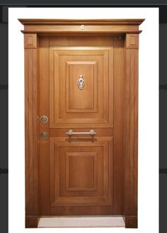 the front door is made from wood and has an ornate handle on it's side