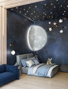 a bed room with a large moon and stars on the wall