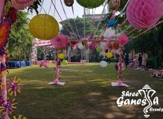 an outdoor area decorated with paper lanterns and decorations