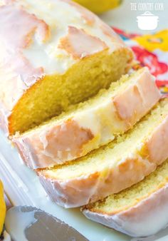 a loaf of lemon pound cake sitting on top of a white plate