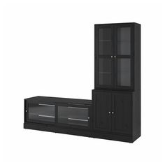 a black entertainment center with glass doors on the top and bottom shelves, in front of a white background