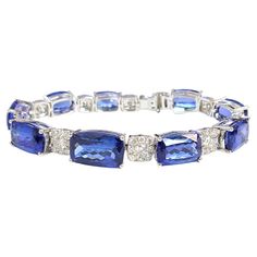 Introducing the 18KW Tanzanite Cushion Bracelet, a brand new masterpiece exuding elegance and luxury. With 45.39 carats of vivid tanzanite and 3.96 carats of sparkling diamonds, this bracelet is a captivating statement piece. Crafted with precision in 18-karat white gold, it combines timeless elegance with contemporary allure. Make a lasting impression with this exquisite and opulent accessory. Modern Bracelets, Vintage Modern, Sparkle Diamonds, Tanzania, Timeless Elegance, Jewelry Bracelets, White Gold, Cushions, Bracelet