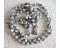 Traditional mala created with 108 sesame jasper beads, and Guan Yin amulet. Jasper brings peace and tranquility, comfort and optimism. Guan Yin/Kwan Yin is the goddess of compassion and protection. Use as a meditation aid or wear as a necklace. Free shipping in the U.S. Aum Sign, Goddess Of Compassion, Peace And Tranquility, Guan Yin, Kuan Yin, Kwan Yin, Small Artwork, Jasper Beads, The Goddess