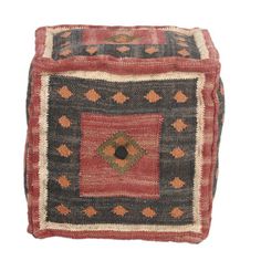 a small square rug with an intricate design on the bottom and sides, sitting on a white background