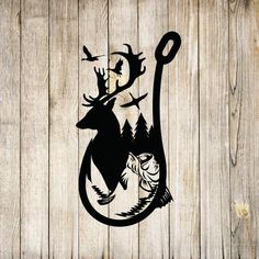 the silhouette of a deer is hanging from a hook on a wooden wall with leaves