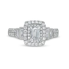 With refined elegance and vintage-inspired details, this diamond engagement ring expresses your love. Crafted in 14K white gold, this sophisticated style features a 1/2 ct. emerald-cut diamond wrapped in a double diamond halo. Along the tiered shank, channel-set baguette-cut diamonds glisten in intricate milgrain borders atop two rows of round diamonds. The inside of the shank is rounded for all-day comfort. Captivating with 1-1/5 cts. t.w. of diamonds and a bright polished shine, this engagemen Shank Engagement Ring, Diamond Frame, Double Diamond, Baguette Cut Diamond, Emerald Stone, Channel Set, Baguette Cut, Emerald Cut Diamonds, Diamond Halo