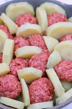 meatballs and potatoes in a bowl on a table