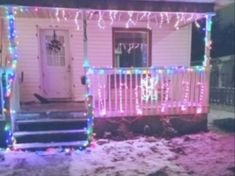 a house with christmas lights on the front porch