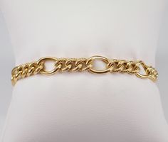 "Vintage Estate 14K Yellow Gold Link Bracelet. This bracelet weighs 7.5 grams, measures 7.5 mm in width and 7 1/4\" in length. This bracelet is traditionally called a textured Figaro Link but can be used for a charm bracelet.   I will ship this bracelet promptly in a gift box.  ADDITIONAL REQUESTS If you would like to see more pictures of this item, please let us know and we would be happy to provide them for you. Please contact us with all questions, we are here to help." Heirloom Yellow Gold Oval Link Bracelets, Heirloom Yellow Gold Oval Link Bracelet, Classic Bangle Charm Bracelet For Formal Occasions, Luxury Figaro Chain Bracelet For Formal Occasions, Formal Tarnish Resistant Charm Bangle Bracelet, Luxury Formal Figaro Chain Bracelet, Formal Oval Link Bracelet With Diamond Cut, Formal Oval Link Diamond Cut Bracelets, Formal Diamond Cut Oval Link Bracelets