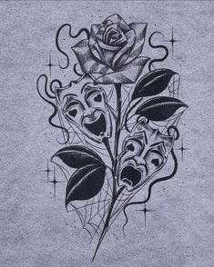 a black and white drawing of a rose on a gray shirt with an intricate design