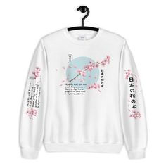 Japanese Blossom Sweatshirt,Aesthetic Shirt,Japanese Shirt,Aesthetic,Aesthetic Clothing,Japanese sweatshirt,Kawaii,Cute,Unisex Sweatshirt A sturdy and warm sweatshirt bound to keep you warm in the colder months. A pre-shrunk, classic fit sweater that's made with air-jet spun yarn for a soft feel and reduced pilling. * 50% cotton, 50% polyester * Pre-shrunk * Classic fit with no center crease * 1x1 athletic rib knit collar with spandex * Air-jet spun yarn with a soft feel and reduced pilling * Do Harajuku Long Sleeve T-shirt For Streetwear, White Harajuku Graphic Print Sweatshirt, White Harajuku Sweatshirt With Graphic Print, White Kawaii Sweatshirt With Graphic Print, White Harajuku Sweatshirt With Anime Print, White Harajuku Style Anime Print Sweatshirt, Harajuku Style Long Sleeve Spring Sweatshirt, Anime Print Tops For Spring Streetwear, White Cotton Sweatshirt With Anime Print