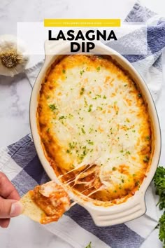 lasagna dip in a white casserole dish with parmesan cheese