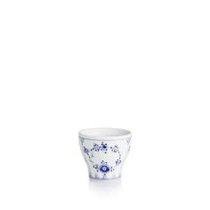 a blue and white cup with flowers on the rim, sitting in front of a white background