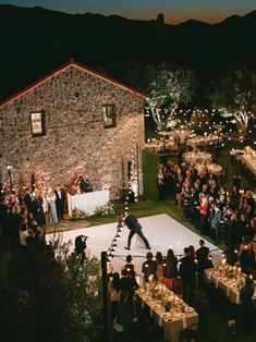 an aerial view of a wedding reception at night