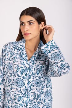 DESCRIPTION: Welcome to our collection of cute and stylish lightweight cotton hand block printed PJ sets. Made with the finest cotton, these sets are designed to provide ultimate comfort and style for your relaxing evenings. With a button-up front, collared neckline, and long sleeves, you'll look effortlessly chic while enjoying a cozy night's sleep. The single accent patch pocket adds a touch of uniqueness to the design, making our PJ sets stand out from the rest. Get ready to feel cute and com Patterned Cotton Loungewear Sets, Cotton Loungewear Sets In Patterned Color, Patterned Cotton Lounge Sets, Cotton Sleepwear With Block Print For Loungewear, Cotton Block Print Sleepwear For Loungewear, Long Sleeve Sets With Printed Motifs For Loungewear, Relaxed Fit Block Print Sleepwear For Loungewear, Block Print Long Sleeve Sleepwear For Loungewear, Contrast Piping