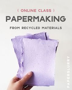 a hand holding a piece of paper with the text online class papermaking from recycled materials