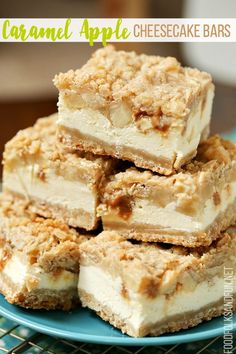 homemade caramel apple cheesecake bars stacked on top of each other in a blue plate