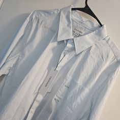 Nwt Men's Blue And White Calvin Klein Dress Shirt. Comes From A Pet Free And Smoke Free Home. Calvin Klein Spring Button-up Shirt, Casual Calvin Klein Collared Shirt, Calvin Klein Cotton Shirt With Spread Collar, Casual Calvin Klein Shirt With Spread Collar, Calvin Klein Casual Shirt With Spread Collar, Classic Calvin Klein Shirt For Summer, Classic Calvin Klein Summer Shirt, Calvin Klein Short Sleeve Shirt For Spring, Casual Long Sleeve Calvin Klein Shirt