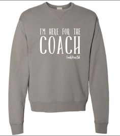 Im Here For the Coach Coaches Wives Crewneck Sweatshirt We LOVE this crewneck! The perfect addition to your outfit! A sturdy and warm sweatshirt bound to keep you warm in the colder months. A pre-shrunk, classic fit sweater that's made with air-jet spun yarn for a soft feel and reduced pilling. * 50% cotton, 50% polyester * Pre-shrunk * Classic fit * 1x1 athletic rib knit collar with spandex * Air-jet spun yarn with a soft feel and reduced pilling * Double-needle stitched collar, shoulders, armholes, cuffs, and hem Coaches Wife, Soccer Mom Shirt, Wife Life, Soccer Mom, Fitted Sweater, Mom Shirts, Rib Knit, Coaching, Sweat Shirt