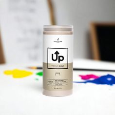 a can of up paint sitting on top of a table