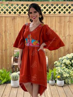 This Beautiful Dress boasts a Traditional Mexican floral design combined with a modern style dress. The embroidered bodice combined with the bell sleeves makes it fun and flirty. It's made out of fine Mexican cotton and has elastic on the back for an adjustable fit. This dress is handmade and hand embroidered by Mexican Artisans in Oaxaca, Mexico. This dress comes in one size: Medium/Large Purchase the shoes modeled here: https://www.etsy.com/es/listing/1001211818/tacones-mexicanos-pintados-a-ma Bohemian Embroidered Fitted V-neck Dress, Traditional V-neck Dress With Embroidered Neckline, Traditional V-neck Dress With Embroidered Border, Folk Style V-neck Dress With Embroidered Hem, Traditional V-neck Embroidered Dress, Fitted Bohemian Embroidered V-neck Dress, Fitted Bohemian Embroidered Dress With V-neck, Fitted V-neck Bohemian Embroidered Dress, Red Folk Style V-neck Dress