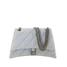 This shoulder bag features a quilted denim exterior and a magnetic flap closure for secure storage. The chain strap allows for easy wear on the shoulder, making it a stylish option for different occasions.

- Quilted denim exterior
- Magnetic flap closure
- Chain strap for shoulder wear Balenciaga Handbags, Stylish Shoulder Bag, Shoulder Chain, Chain Bag, Magnetic Clasp, Birkin Bag, Denim Blue, Gucci Jackie Bag, Dior Saddle Bag