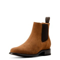 Handcrafted in León, Mexico, the Reed boot blends classic Western style with the iconic Chelsea silhouette. Made with soft, premium Italian calf leather, it's comfortable straight out of the box and fits seamlessly under slimmer jeans and pants. Bench Made Reed Western Boot | Product Features : 0 : Removable All Day Cushioning insole with genuine vegetable tanned, anti-odor leather sock liner that molds to your foot, 1 : Cork filled forefoot for added comfort and cushioning, 2 : Resolable 9-iron Western Leather Chelsea Boots With Goodyear Welt, Goodyear Welted Leather Western Chelsea Boots, Classic Chelsea Boots With Heel Pull Tab For Fall, Classic Calf Leather Ankle Work Boots, Classic Medium Width Moto Boots For Work, Western Calf Leather Boots For Workwear, Classic Moto Boots Medium Width For Workwear, Classic Ankle Work Boots In Calf Leather, Classic Moc Toe Boots With Heel Pull Tab