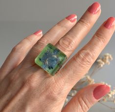 Chunky glass ring in lime green and blue colors. A unique statement piece infusing you with confidence. Handmade glass in lime green and blue colors, with a hint of black. The decor is hand painted and trapped inside the glass creating a fascinating depth effect. The ring band is adjustable size so you can adapt it to any finger, which makes it perfect for gift. This ring has an amazing tiny bubble landscape inside which is magnified by the thickness of the glass. It has softly rounded corners a Handmade Modern Green Jewelry, Green Handmade Modern Jewelry, Modern Handmade Green Jewelry, Modern Green Handmade Jewelry, Unique Green Rectangular Jewelry, Unique Green Rectangular Rings, Green Glass Jewelry Gift, Green Glass Jewelry As Gift, Green Glass Jewelry As A Gift