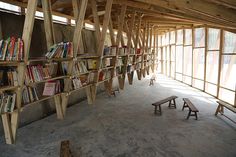 the bookshelves are lined up against the wall