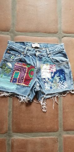 Upcycled, small batch shorts.  These are so comfy you could live in them.  Get em before there gone . Size 29. A button can be added if you need a smaller waist size. Short Spring Bottoms With Patchwork, Casual Patchwork Shorts, Blue Cotton Patchwork Shorts, Bohemian Cotton Bottoms With Collage Stitching, Bohemian Cotton Bottoms With Patches, Casual Upcycled Cotton Bottoms, Relaxed Fit Patchwork Bottoms For Summer, Short Cotton Bottoms With Patches, Upcycled Bottoms For Summer