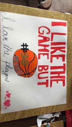 there is a sign that says cake for the basketball team on it, and an image of a basketball