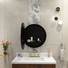 a bathroom with a sink, mirror and toilet paper roll on the wall next to it