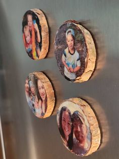 three magnets with family photos on them are hanging on the wall in front of a stainless steel refrigerator