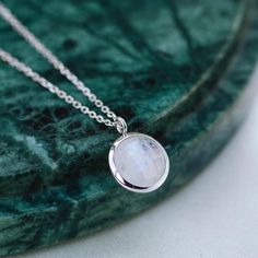 Dainty Moonstone necklace for women in 14K solid gold. A dainty gold birthstone necklace ideal for birthday gift or for Christmas. Genuine rainbow moonstone pendant on 14K solid gold chain with a spring clasp. Moonstone is also June birthstone.  100% handcrafted with love! D E T A I L S● Metal: 14K solid gold, 14K white gold or 14K rose gold● Gemstone: Moonstone, round briolette cut ● Stone Diameter: 10mm (0.4in)● Length: 39cm (15.5in) to 47cm (18.5)H O W ∙ T O ∙ O R D E RChoose from the drop do Genuine Turquoise Jewelry, Gold Birthstone Necklace, Gold Gemstone Necklace, Purple Sapphire Ring, Gold Necklace For Women, Lehenga Red, Turquoise Gold Ring, Moonstone Pendant Necklace, Rainbow Moonstone Necklace