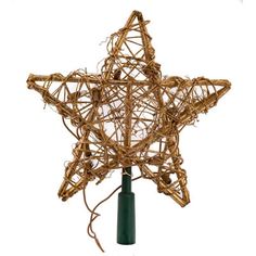 a christmas tree topper made out of branches and lights on a green pole against a white background