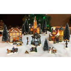 a christmas village with lots of houses and trees