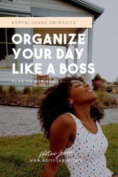 a woman sitting on the grass in front of a house with text that reads organize your day like a boss