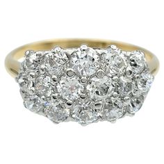 an antique diamond cluster ring in yellow gold