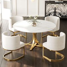 a dining room table with white chairs and a vase on the center piece in front of it