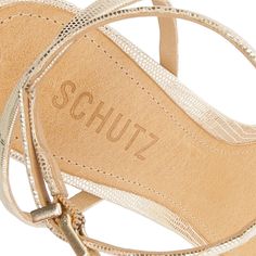 Founded in 1995 by Alexandre Birman, Schutz redefines attainable luxury with its stylish footwear. With each new release, the brand delivers of-the-moment collections, defined by confident, bold, designs around which entire outfits can be built. Crafted in premium materials, the epitome of evening elegance reveals itself in the Altina Embossed-Leather Sandal. Boasting barely-there straps, including an adjustable ankle strap, an a poised stiletto heel, it's alluring from every angle. Product Deta Open Toed Heels, Evening Shoes, Metallic Leather, Strappy Sandals, Gold Material, Embossed Leather, Cow Leather, Leather Fashion, Leather Sandals