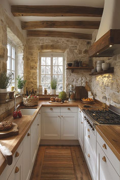 A rustic country kitchen with exposed wooden beams, antique cookware, and a homely atmosphere that’s timeless. Art On Kitchen Cabinets, Rustic Home Decor Diy Ideas, Kitchen Ideas Cozy Rustic, Kitchen Interior Cozy, Country Style Windows, Kitchen Back Wall Ideas, Country Romance Interior Design, Cottage Home Kitchen, Window Cabinets Kitchen